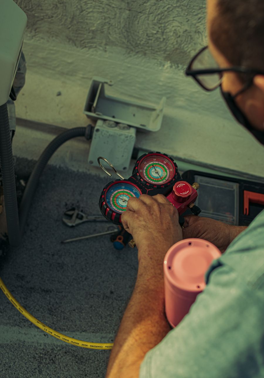 Technician servicing a home mechanical system